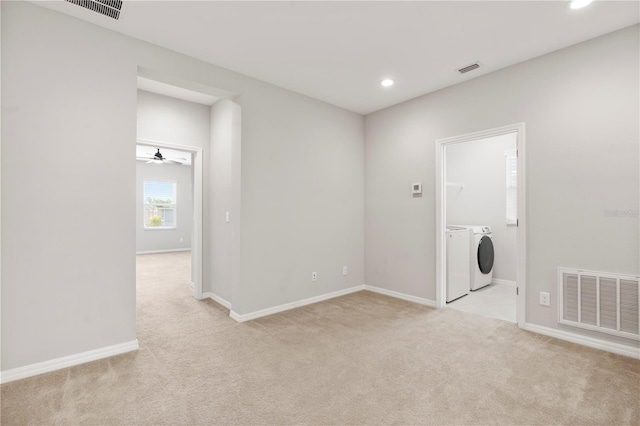 6711 Rocky Park St, Tampa, FL 33625 - empty room with independent washer and dryer, light colored carpet, recessed lighting, and baseboards
