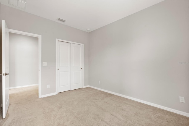 6711 Rocky Park St, Tampa, FL 33625 - unfurnished bedroom with light colored carpet, baseboards, and a closet