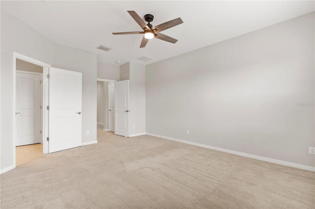 6711 Rocky Park St, Tampa, FL 33625 - unfurnished bedroom featuring light colored carpet, baseboards, and ceiling fan