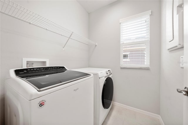 6711 Rocky Park St, Tampa, FL 33625 - laundry room featuring washing machine and clothes dryer and baseboards