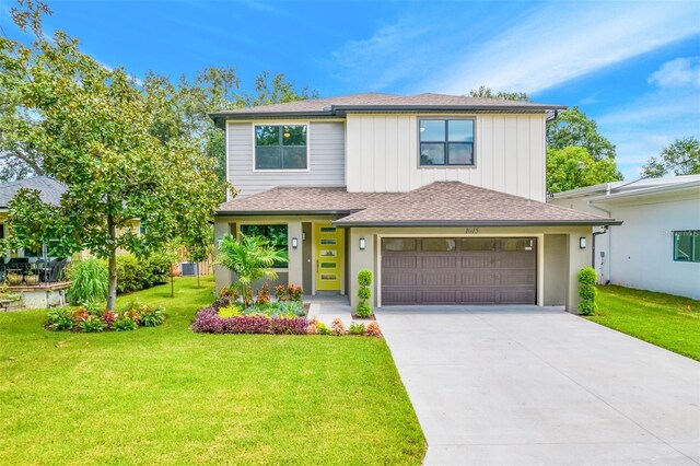 14808 Lake Magdalene Cir, Tampa, FL 33613 - view of front of home featuring concrete driveway, a front yard, a shingled roof, and an attached garage