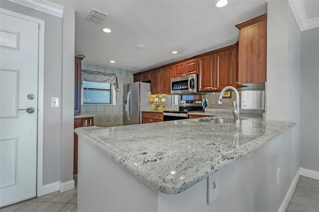 7300 Sun Island Dr S Unit 1505, South Pasadena, FL 33707 - kitchen featuring stainless steel appliances, light stone counters, a peninsula, brown cabinetry, and recessed lighting
