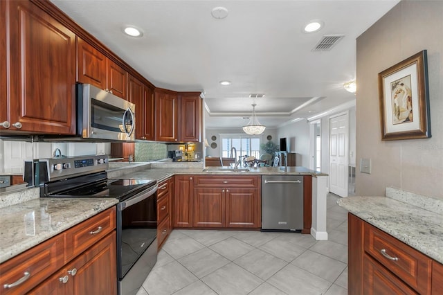 7300 Sun Island Dr S Unit 1505, South Pasadena, FL 33707 - kitchen with appliances with stainless steel finishes, a peninsula, a raised ceiling, open floor plan, and light tile patterned flooring