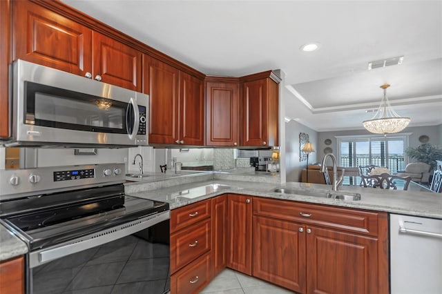 7300 Sun Island Dr S Unit 1505, South Pasadena, FL 33707 - kitchen with appliances with stainless steel finishes, a chandelier, light tile patterned floors, light stone countertops, and decorative light fixtures