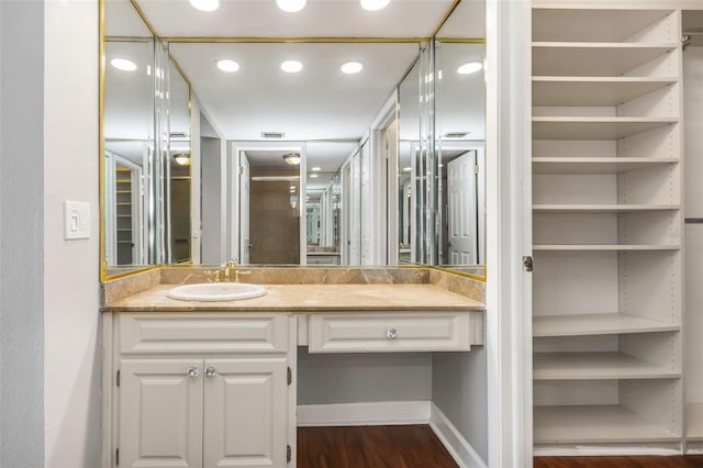 7300 Sun Island Dr S Unit 1505, South Pasadena, FL 33707 - bathroom featuring vanity, wood finished floors, recessed lighting, and a closet