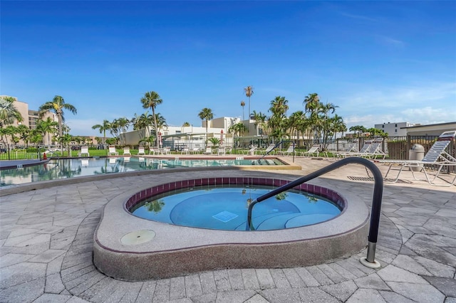 7300 Sun Island Dr S Unit 1505, South Pasadena, FL 33707 - community pool featuring a hot tub and a patio