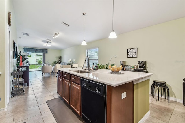 14206 Covert Green Pl, Riverview, FL 33579 - kitchen with dishwasher, a sink, light tile patterned floors, light countertops, and hanging light fixtures