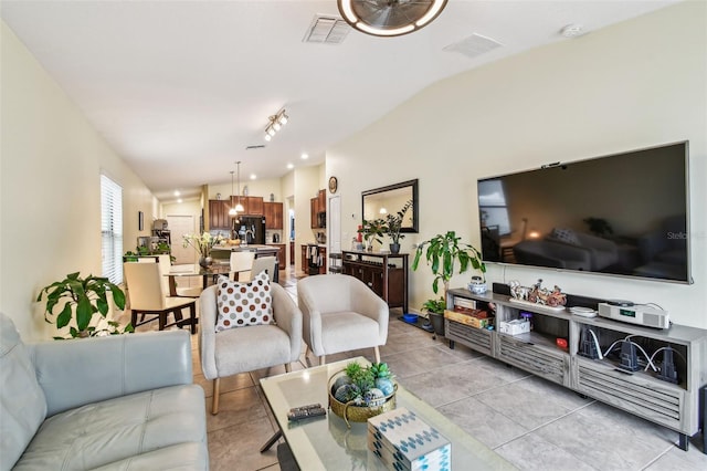 14206 Covert Green Pl, Riverview, FL 33579 - living room with light tile patterned floors and vaulted ceiling