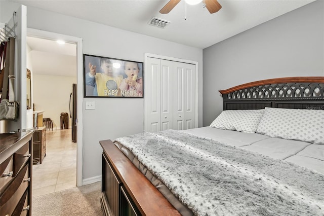 14206 Covert Green Pl, Riverview, FL 33579 - bedroom featuring a closet, light tile patterned floors, light colored carpet, and ceiling fan