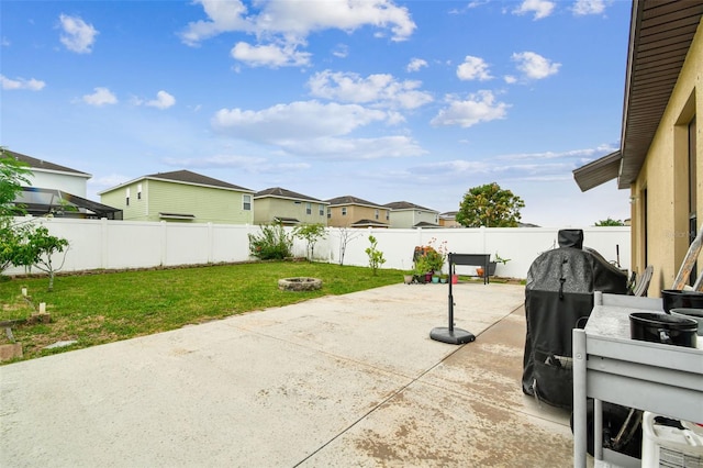 14206 Covert Green Pl, Riverview, FL 33579 - view of patio featuring a fire pit and a residential view