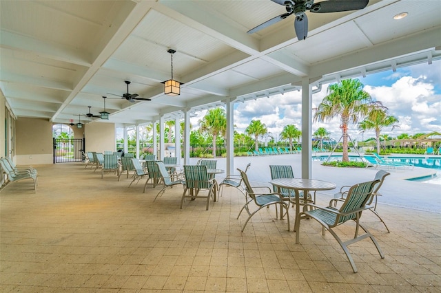 14206 Covert Green Pl, Riverview, FL 33579 - view of patio featuring a ceiling fan, a community pool, outdoor dining area, and a gate