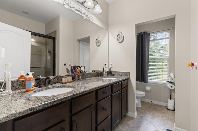 7001 Interbay Blvd Unit 242, Tampa, FL 33616 - bathroom featuring toilet, a shower stall, double vanity, and healthy amount of natural light