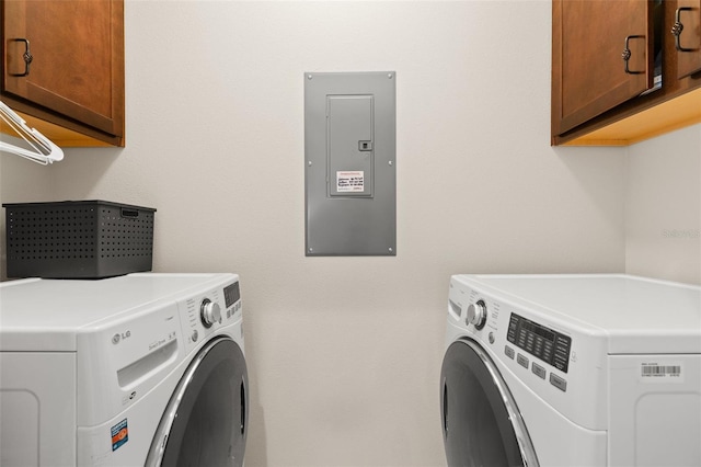 7001 Interbay Blvd Unit 242, Tampa, FL 33616 - laundry area with electric panel, cabinet space, and washer and clothes dryer
