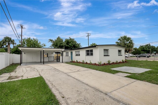 7524 Tidewater Trl, Tampa, FL 33619 - view of front of home with driveway and an attached carport