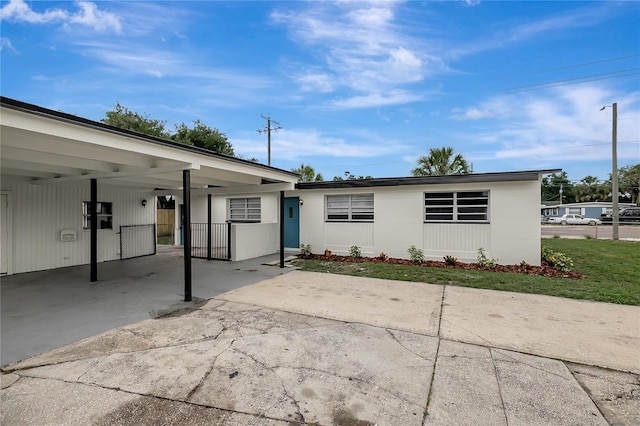 7524 Tidewater Trl, Tampa, FL 33619 - view of front of property featuring driveway and an attached carport