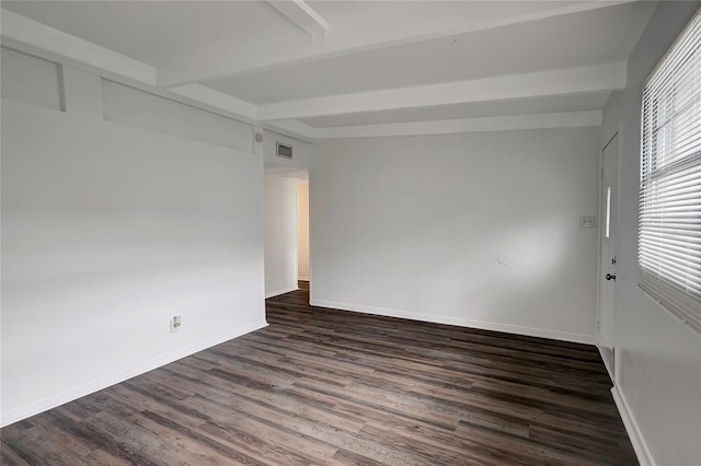 7524 Tidewater Trl, Tampa, FL 33619 - spare room with beam ceiling, dark wood finished floors, and baseboards