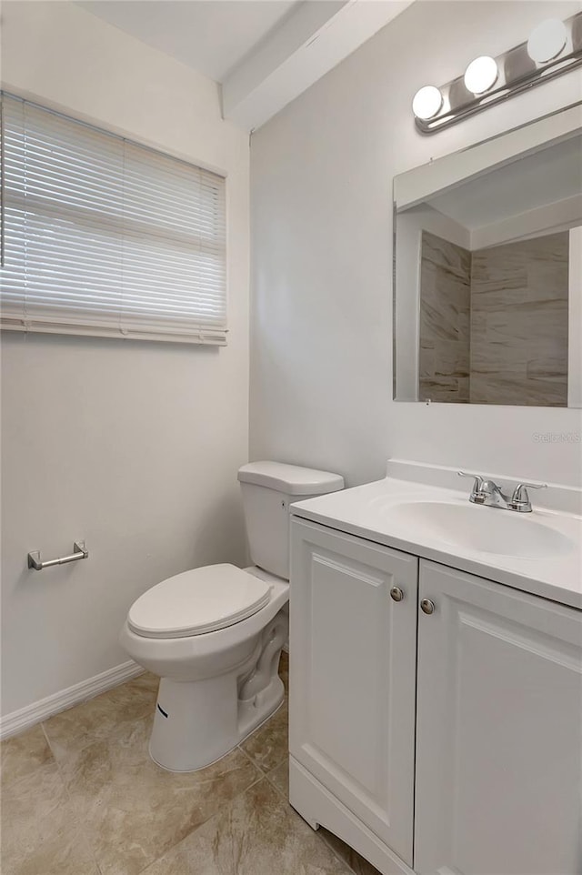 7524 Tidewater Trl, Tampa, FL 33619 - bathroom featuring vanity, toilet, and baseboards