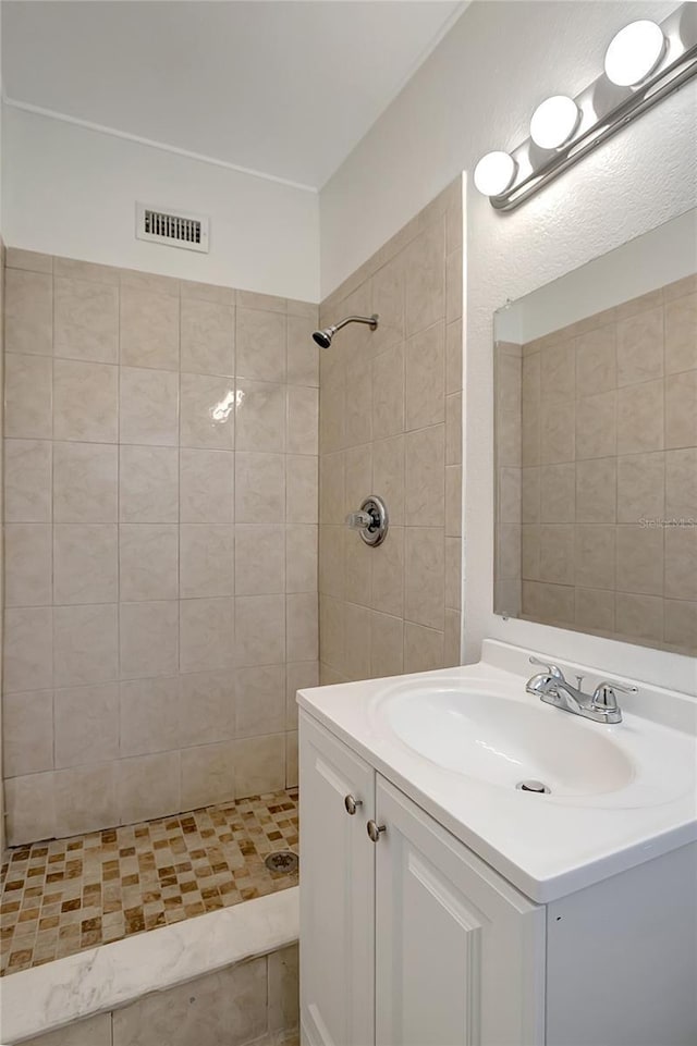 7524 Tidewater Trl, Tampa, FL 33619 - bathroom featuring vanity and a tile shower