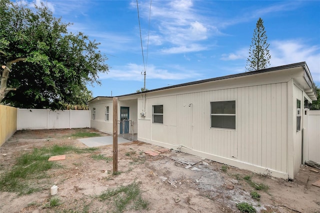 7524 Tidewater Trl, Tampa, FL 33619 - rear view of house featuring a fenced backyard and a patio