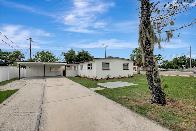 7524 Tidewater Trl, Tampa, FL 33619 - single story home featuring concrete driveway and a carport
