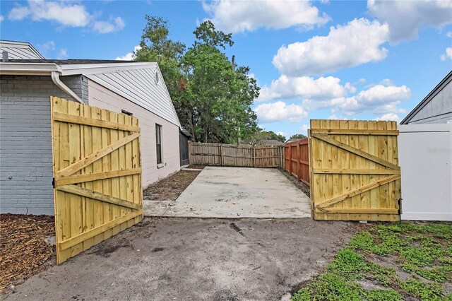 1717 Osprey Ln, Lutz, FL 33549 - view of yard featuring a gate and a patio