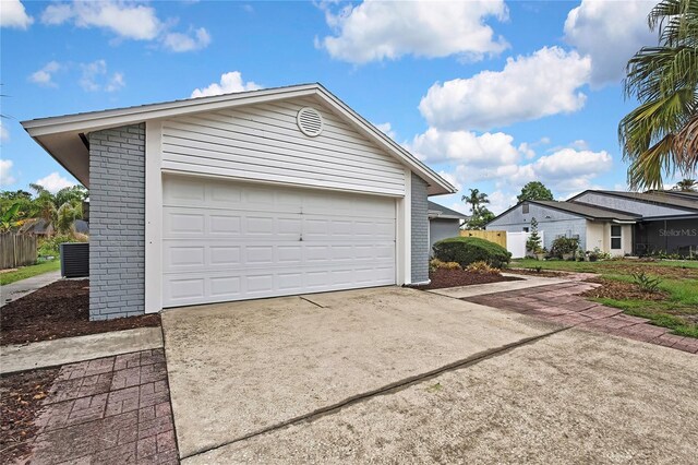 1717 Osprey Ln, Lutz, FL 33549 - garage featuring concrete driveway