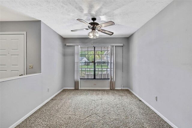 1717 Osprey Ln, Lutz, FL 33549 - spare room with carpet flooring, ceiling fan, baseboards, and a textured ceiling