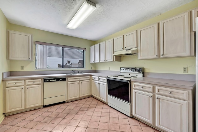 1717 Osprey Ln, Lutz, FL 33549 - kitchen with white appliances, a sink, under cabinet range hood, light tile patterned floors, and light countertops