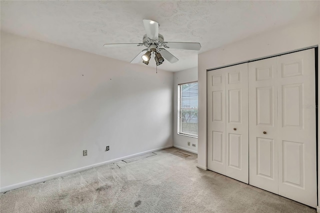 1717 Osprey Ln, Lutz, FL 33549 - unfurnished bedroom with carpet flooring, baseboards, a closet, and ceiling fan