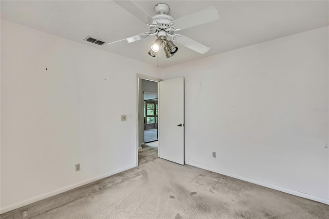 1717 Osprey Ln, Lutz, FL 33549 - empty room featuring light colored carpet, ceiling fan, and baseboards