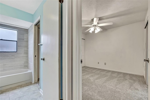 1717 Osprey Ln, Lutz, FL 33549 - unfurnished bedroom featuring baseboards, light carpet, and ceiling fan