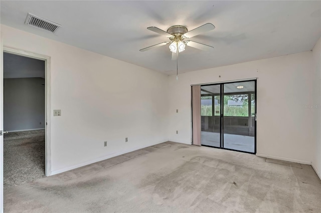 1717 Osprey Ln, Lutz, FL 33549 - empty room with light colored carpet, ceiling fan, and baseboards