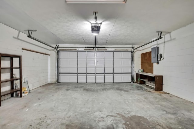 1717 Osprey Ln, Lutz, FL 33549 - garage with electric panel and a garage door opener