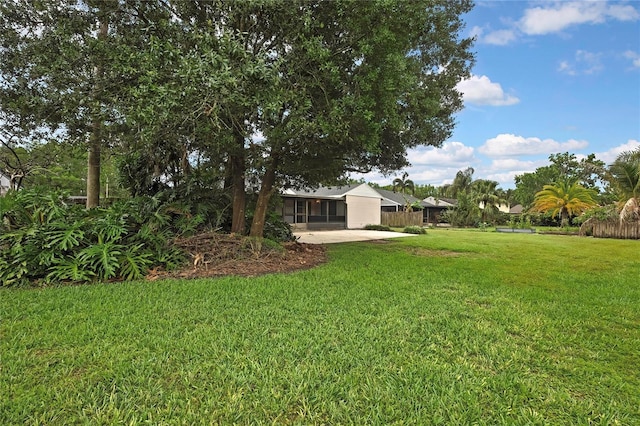 1717 Osprey Ln, Lutz, FL 33549 - view of grassy yard with a patio