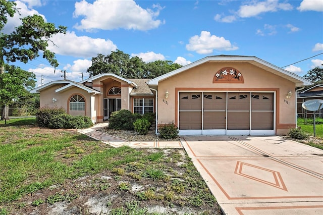 6121 Piedmont Dr, Spring Hill, FL 34606 - single story home with stucco siding, concrete driveway, and an attached garage