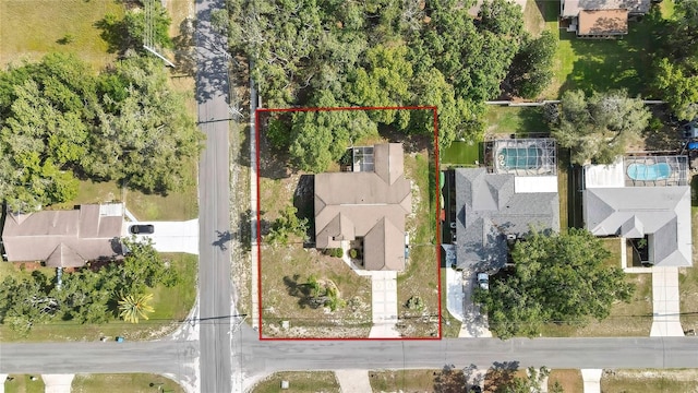 6121 Piedmont Dr, Spring Hill, FL 34606 - aerial overview of property's location with property parcel outlined and a pool