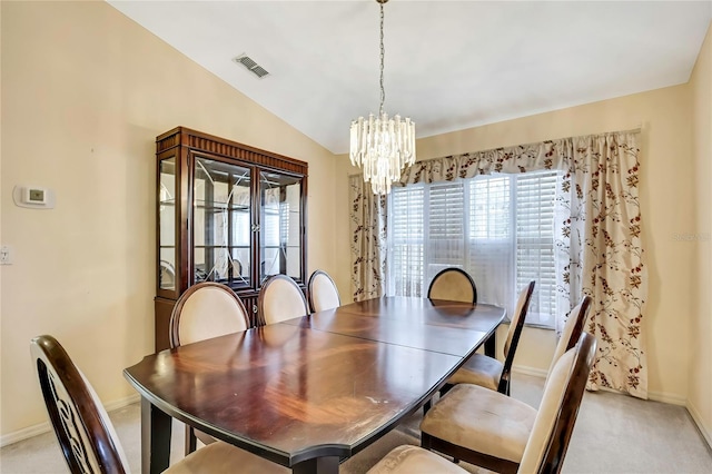 6121 Piedmont Dr, Spring Hill, FL 34606 - dining area with baseboards, a chandelier, light carpet, and lofted ceiling