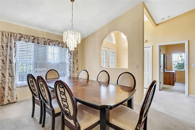 6121 Piedmont Dr, Spring Hill, FL 34606 - dining space with a chandelier, light carpet, and healthy amount of natural light