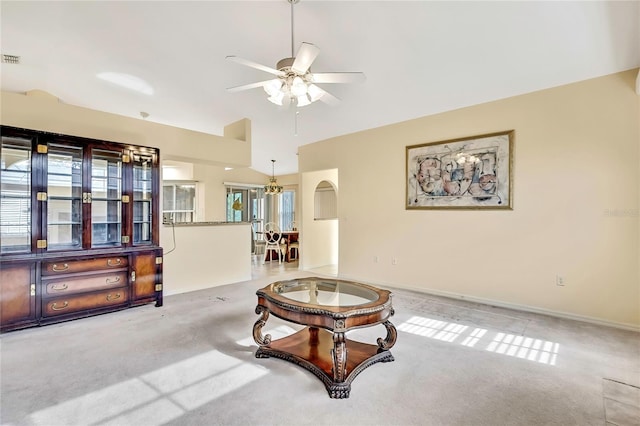 6121 Piedmont Dr, Spring Hill, FL 34606 - living area with a ceiling fan, carpet flooring, a chandelier, lofted ceiling, and baseboards