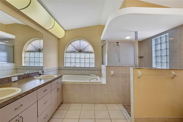 6121 Piedmont Dr, Spring Hill, FL 34606 - bathroom with a walk in shower, a garden tub, tile patterned floors, and double vanity