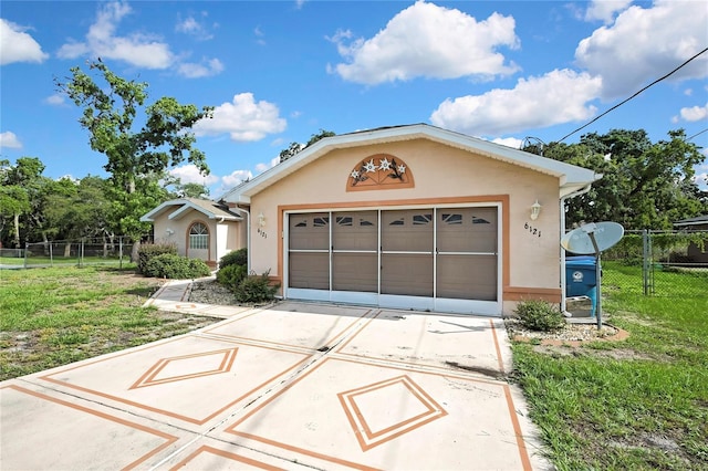 6121 Piedmont Dr, Spring Hill, FL 34606 - view of front of home with stucco siding and concrete driveway