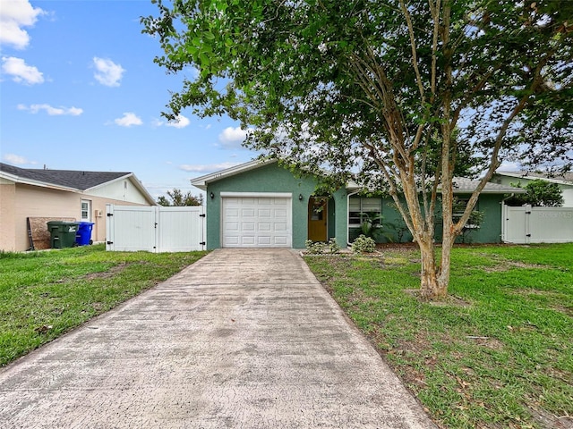 1238 Honeytree Ln E, Lakeland, FL 33801 - ranch-style home featuring a gate, concrete driveway, an attached garage, and stucco siding