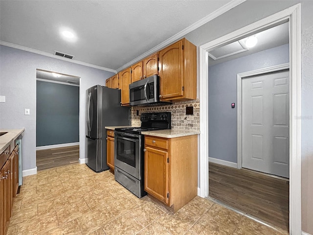 1238 Honeytree Ln E, Lakeland, FL 33801 - kitchen featuring appliances with stainless steel finishes, light countertops, ornamental molding, backsplash, and baseboards
