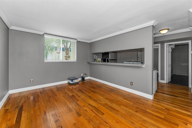 1301 S Howard Ave Unit A22, Tampa, FL 33606 - unfurnished room featuring ornamental molding, hardwood / wood-style flooring, and baseboards