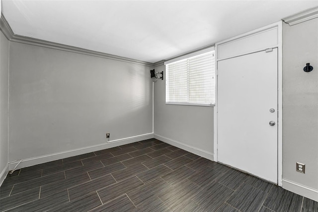 1301 S Howard Ave Unit A22, Tampa, FL 33606 - empty room with baseboards, wood finish floors, and ornamental molding