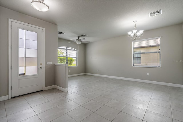 19974 Bluebird Meadow Dr, Lutz, FL 33558 - empty room featuring a chandelier, light tile patterned floors, and a textured ceiling