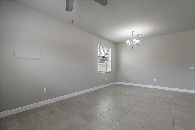 19974 Bluebird Meadow Dr, Lutz, FL 33558 - tiled spare room featuring ceiling fan and a chandelier
