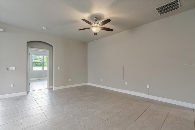 19974 Bluebird Meadow Dr, Lutz, FL 33558 - unfurnished room featuring a ceiling fan, light tile patterned flooring, and a smoke detector