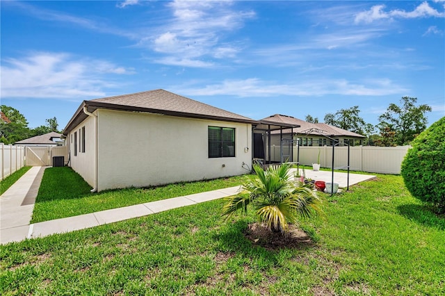 19974 Bluebird Meadow Dr, Lutz, FL 33558 - back of house with a fenced backyard, a patio, a sunroom, and stucco siding