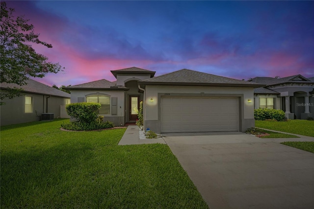 19974 Bluebird Meadow Dr, Lutz, FL 33558 - view of front of house with stucco siding, a garage, concrete driveway, and a yard